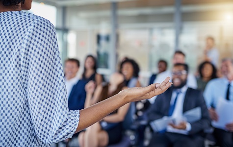 Worker presents in front of people